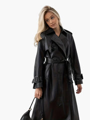 Women's long black faux leather belted trench coat, elongated statement silhouette