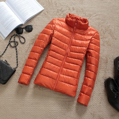 Women's shiny quilted short puffer jacket with zip-up front in multiple colours