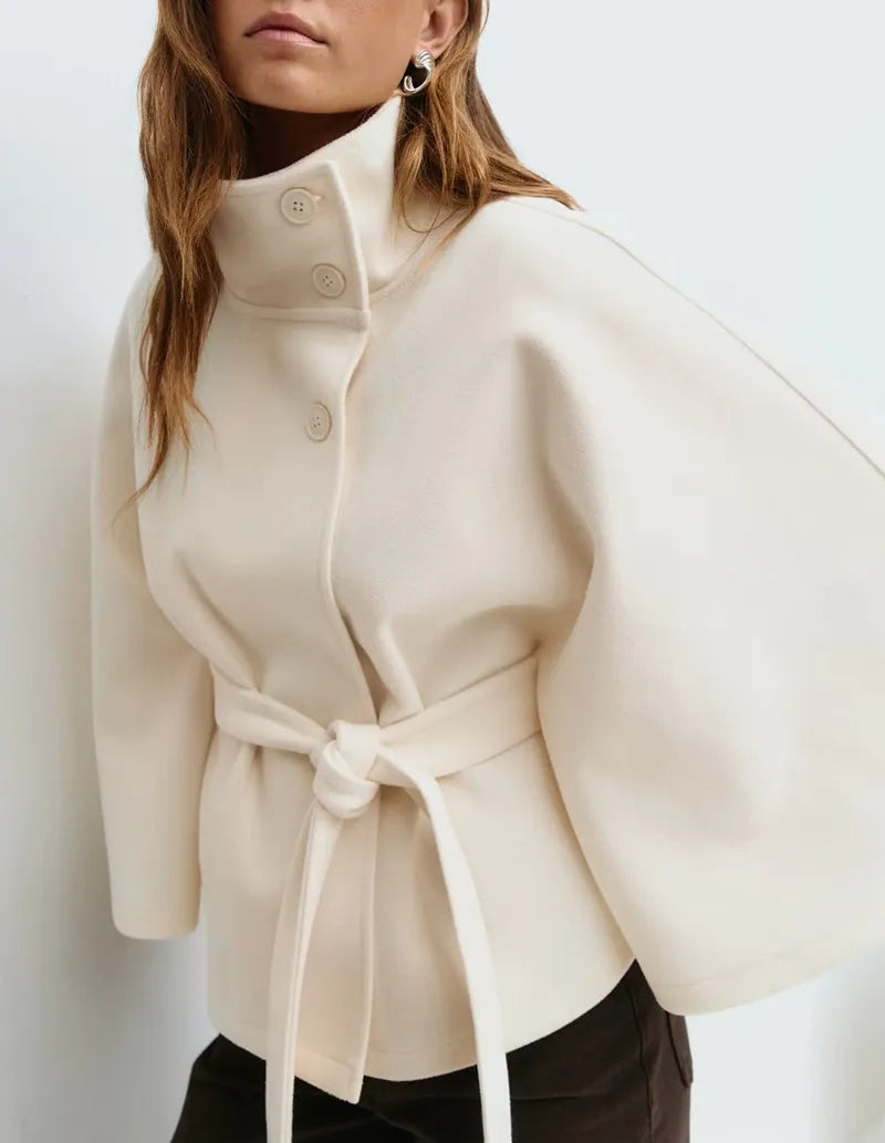 Women's belted cape jacket with high neckline and tie waist for smart casual layering